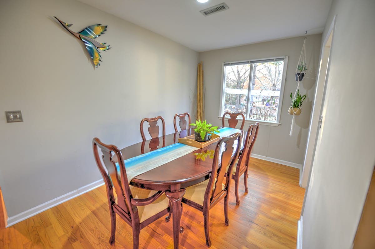 Dining room with an oval wood table seating six