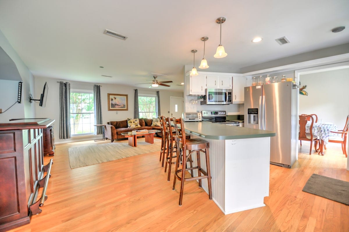 Open kitchen and living area with island seating
